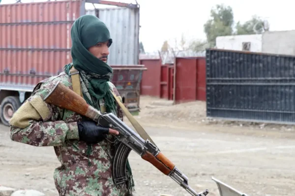 A Taliban soldier stands watch at the Afghanistan-Pakistan border in Spin Boldak, in the year 2022